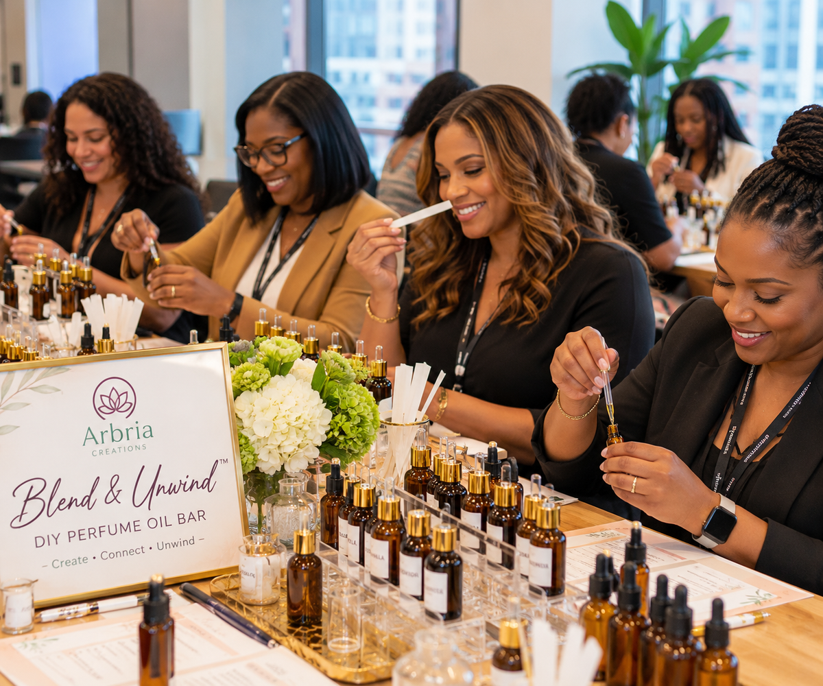 Employees creating custom perfume oils at a corporate wellness workshop in the Bay Area