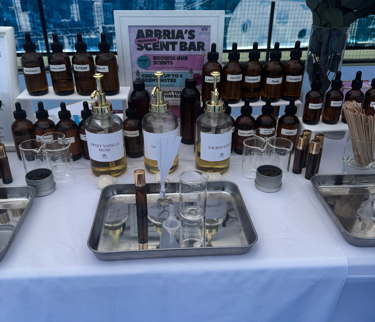 Plant-based body oil bar with bottles and botanicals